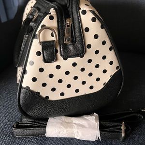 Vegan leather black and white polka dot purse.